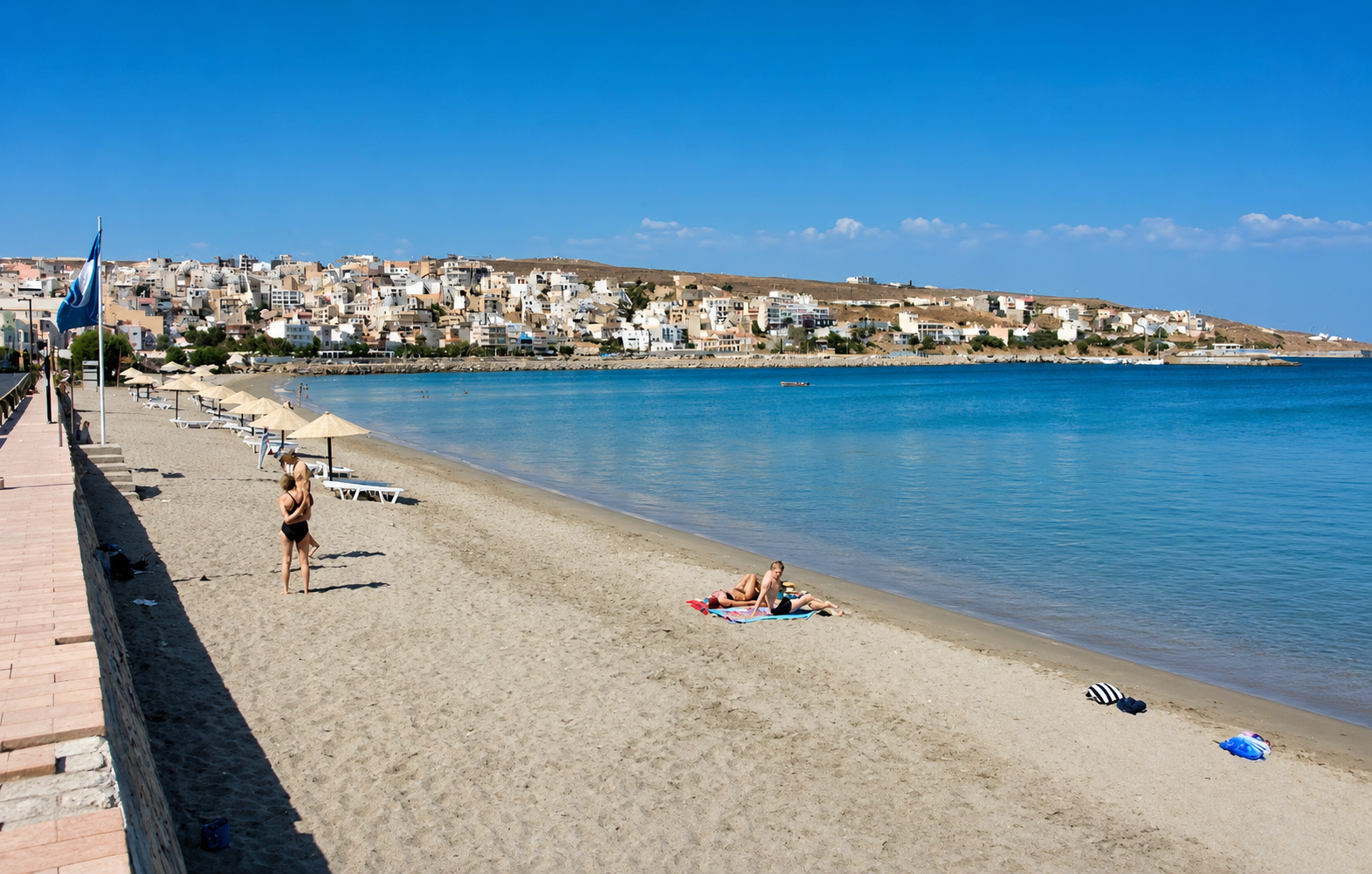 Sitia beach with sunbeds and umbrellas near Sitia Water Sports